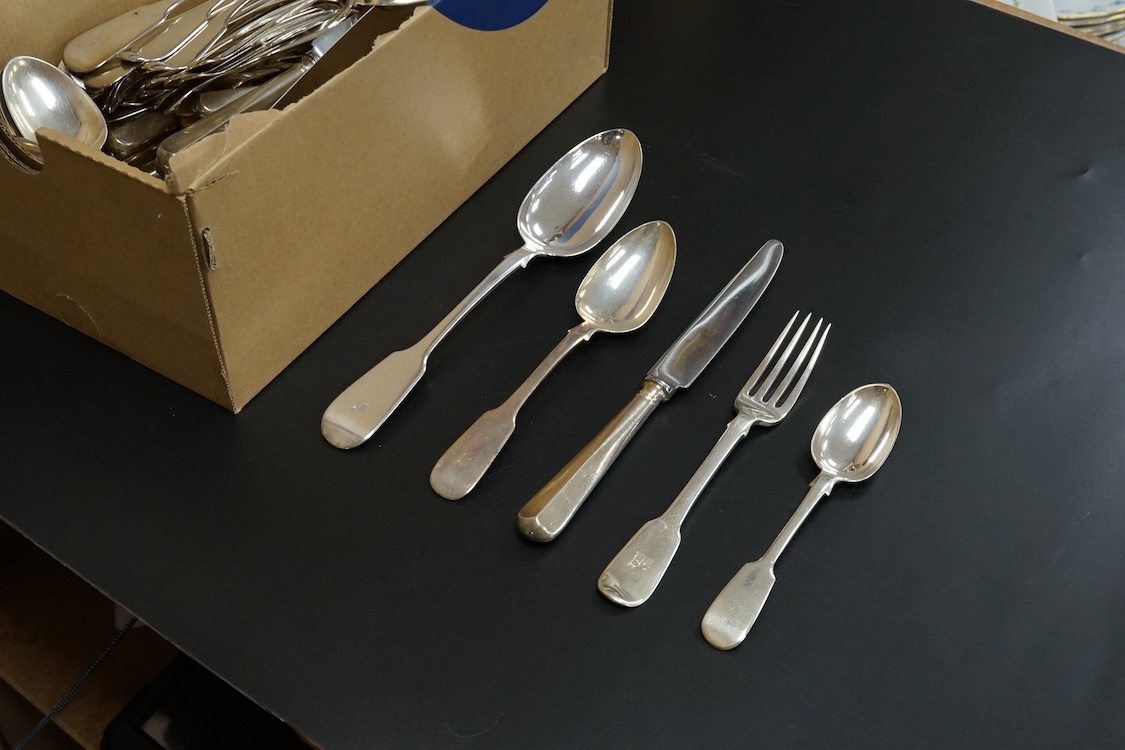 A harlequin part canteen of 19th century silver fiddle pattern flatware, comprising fifty four items, various dates and makers including twelve table spoons, twelve table forks and six dessert spoons with engraved initia